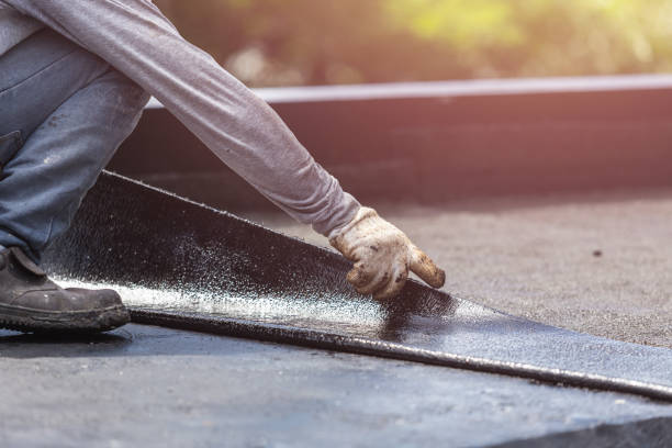 Professional Basement Waterproofing technician working in Williamsburg, KY